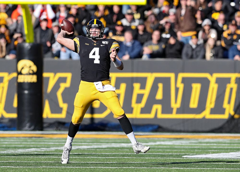 Iowa Hawkeyes quarterback Nate Stanley (4) throws a pass on the run during the third quarter of their game at Kinnick Stadium in Iowa City on Saturday, Nov 23, 2019. (Stephen Mally/hawkeyesports.com)