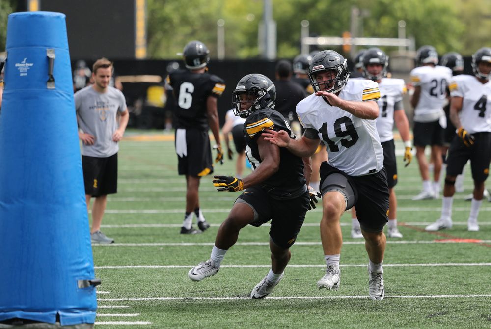 Iowa Hawkeyes running back Mekhi Sargent (10) and linebacker Mike Timm (19) during practice No. 4 of Fall Camp Monday, August 6, 2018 at the Hansen Football Performance Center. (Brian Ray/hawkeyesports.com)