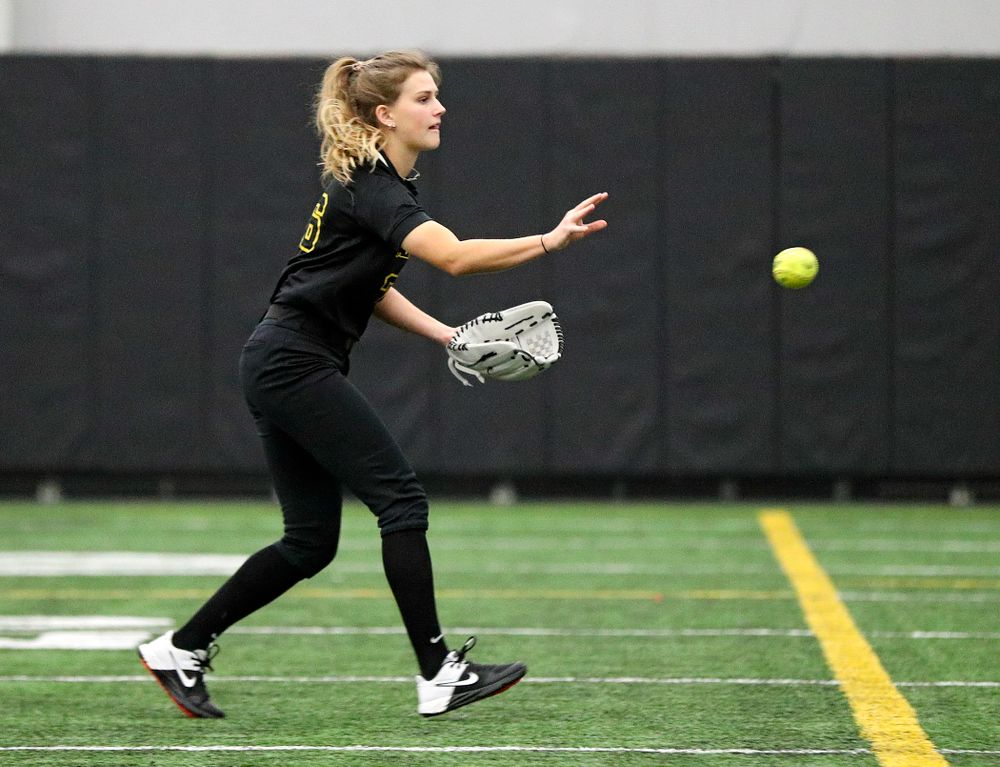 Iowa infielder Mia Ruther (26) tosses the ball to first base during practice at Iowa Softball Media Day at the Hawkeye Tennis and Recreation Complex in Iowa City on Thursday, January 30, 2020. (Stephen Mally/hawkeyesports.com)