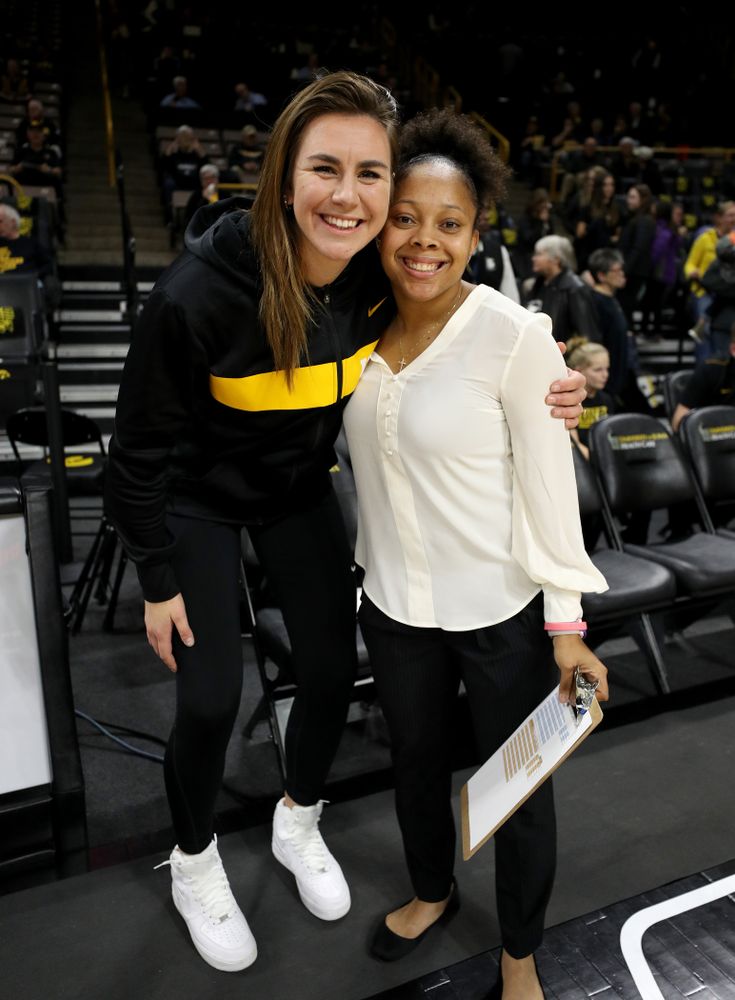 Former Hawkeyes Hannah Stewart and Tania Davis pose for a photo before the Iowa Hawkeyes game against Clemson Wednesday, December 4, 2019 at Carver-Hawkeye Arena. (Brian Ray/hawkeyesports.com)