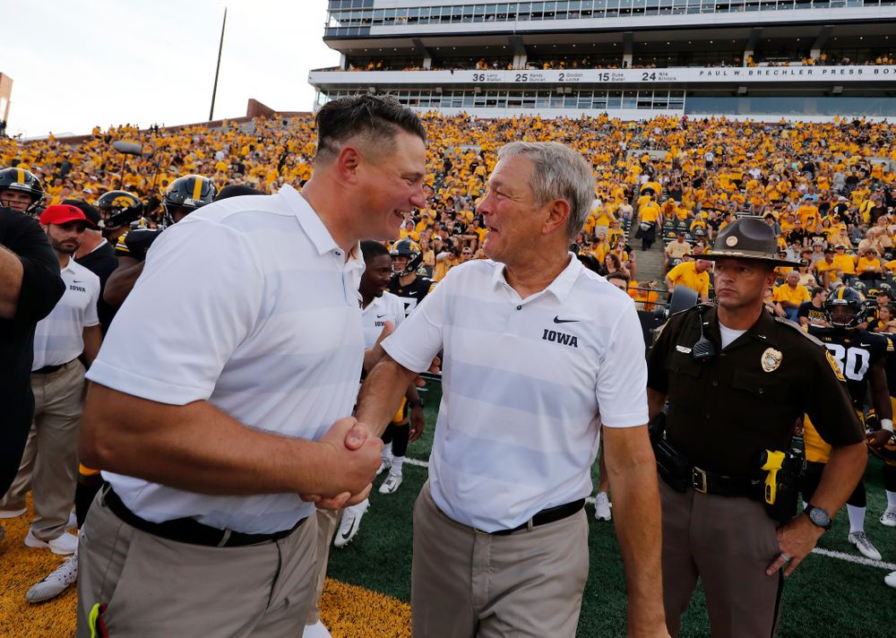 Iowa Hawkeyes head coach Kirk Ferentz shakes hands with his son offensive coordinator Brian Ferentz following their game against the Northern Illinois Huskies Saturday, September 1, 2018 at Kinnick Stadium. (Brian Ray/hawkeyesports.com)