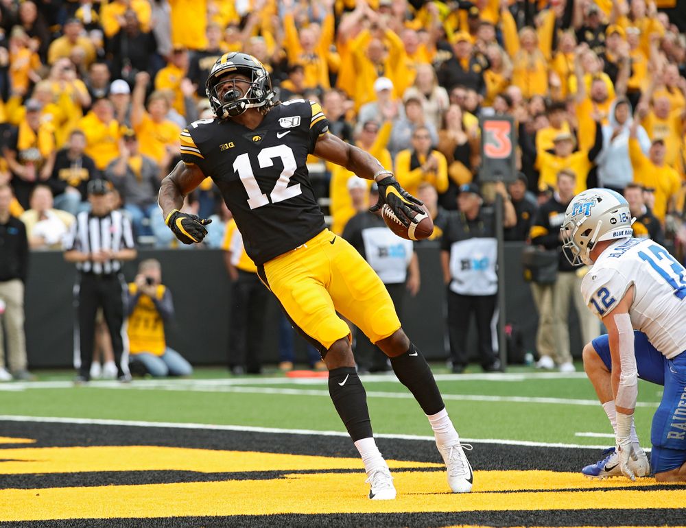 Iowa Hawkeyes wide receiver Brandon Smith (12) celebrates after a 10-yard touchdown reception during fourth quarter of their game at Kinnick Stadium in Iowa City on Saturday, Sep 28, 2019. (Stephen Mally/hawkeyesports.com)