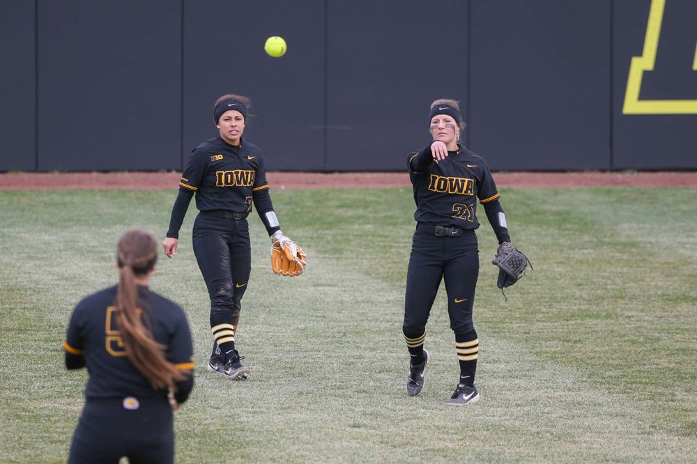 Iowa outfielder Lea Thompson (7) and Iowa's Havyn Monteer (21) at game 2 vs Northwestern on Saturday, March 30, 2019 at Bob Pearl Field. (Lily Smith/hawkeyesports.com)