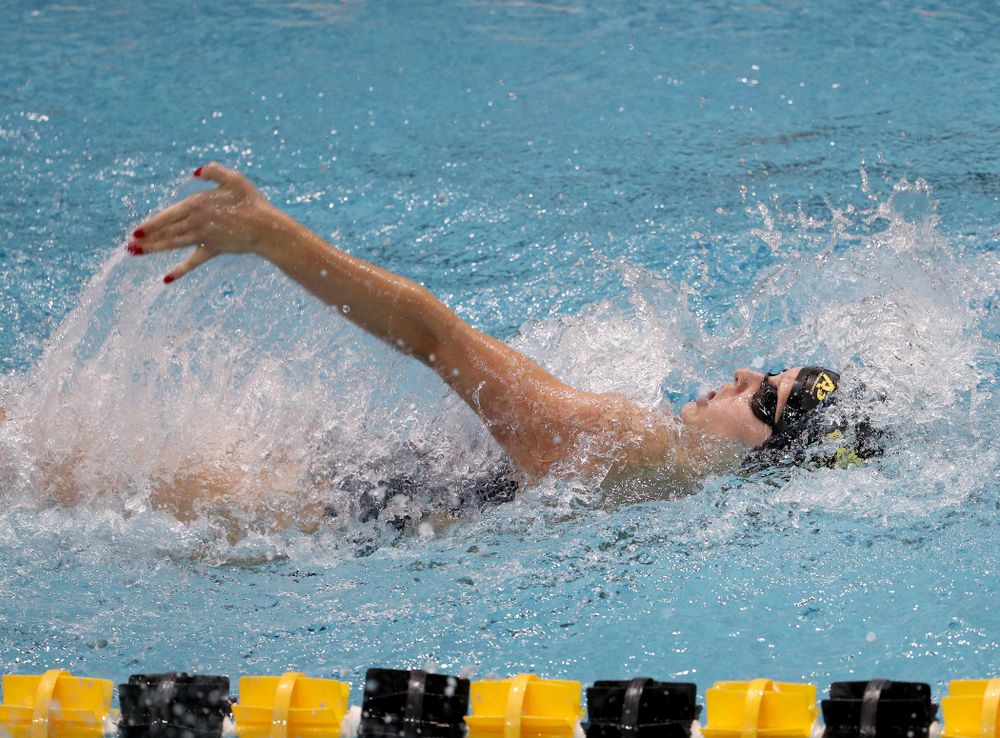 IowaÕs Julia Koluch competes in the 100 yard backstroke against Notre Dame and Illinois Saturday, January 11, 2020 at the Campus Recreation and Wellness Center.  (Brian Ray/hawkeyesports.com)