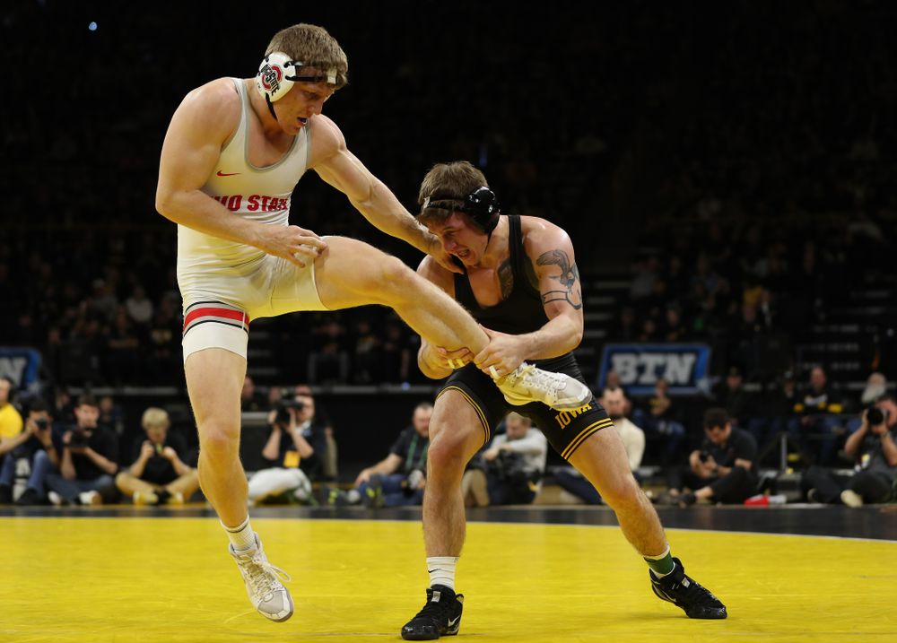 Iowa’s Cash Wilcke wrestles Ohio State’s Kollin Moore at 197 pounds Friday, January 24, 2020 at Carver-Hawkeye Arena. Moore won the match 8-3. (Brian Ray/hawkeyesports.com)