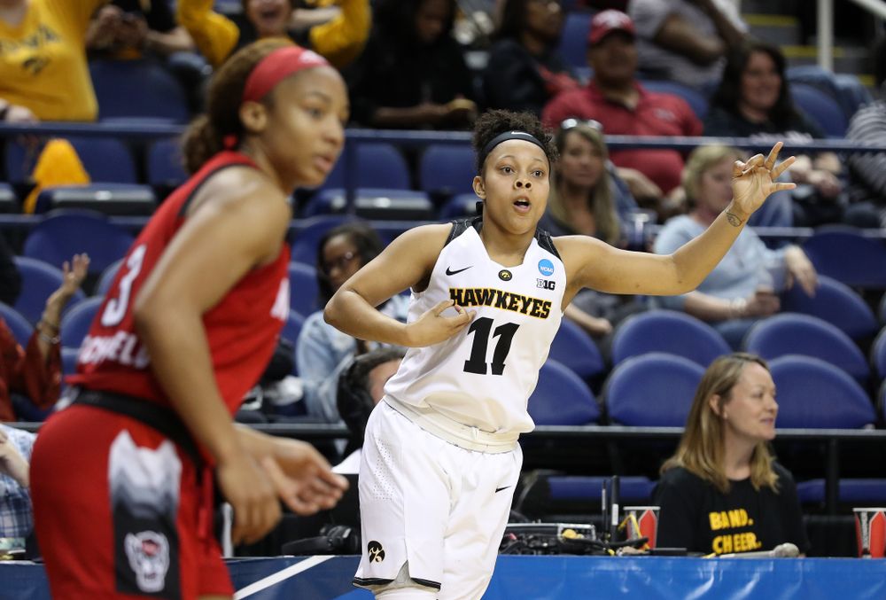 Iowa Hawkeyes guard Tania Davis (11) celebrates a three point basket against the NC State Wolfpack in the regional semi-final of the 2019 NCAA Women's College Basketball Tournament Saturday, March 30, 2019 at Greensboro Coliseum in Greensboro, NC.(Brian Ray/hawkeyesports.com)
