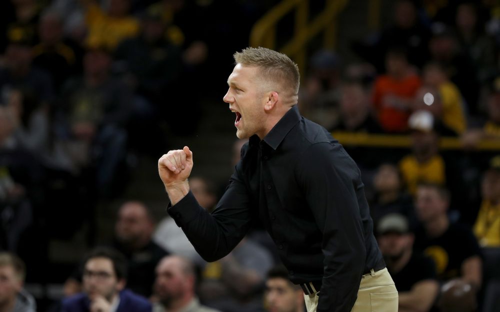 Iowa assistant coach Ryan Morningstar cheers as Max Murin wrestles WisconsinÕs Tristan Moran at 141 pounds Sunday, December 1, 2019 at Carver-Hawkeye Arena. Murin won the match 3-2. (Brian Ray/hawkeyesports.com)