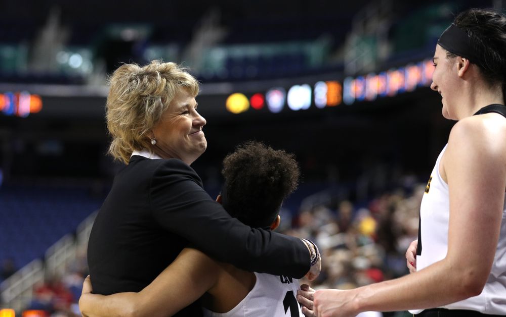 Iowa Hawkeyes head coach Lisa Bluder and guard Tania Davis (11) against the NC State Wolfpack in the regional semi-final of the 2019 NCAA Women's College Basketball Tournament Saturday, March 30, 2019 at Greensboro Coliseum in Greensboro, NC.(Brian Ray/hawkeyesports.com)