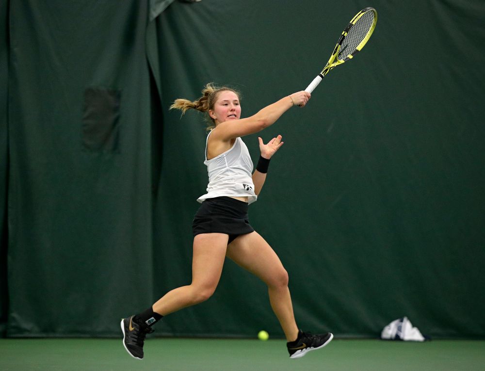 Iowa’s Danielle Burich returns a shot during her singles match at the Hawkeye Tennis and Recreation Complex in Iowa City on Sunday, February 23, 2020. (Stephen Mally/hawkeyesports.com)