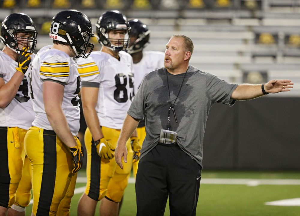 Iowa Hawkeyes offensive line coach Tim Polasek talks with offensive lineman Taylor Fox (58) during Fall Camp Practice No. 12 at Kinnick Stadium in Iowa City on Thursday, Aug 15, 2019. (Stephen Mally/hawkeyesports.com)