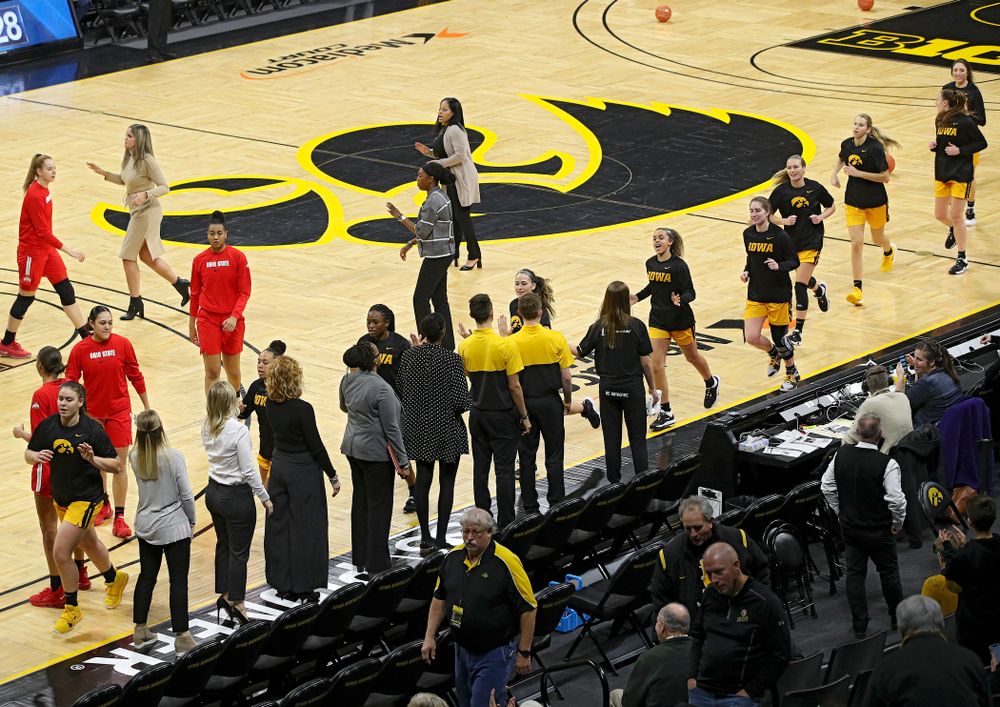 The Hawkeyes run off the court after warming up before their game at Carver-Hawkeye Arena in Iowa City on Thursday, January 23, 2020. (Stephen Mally/hawkeyesports.com)