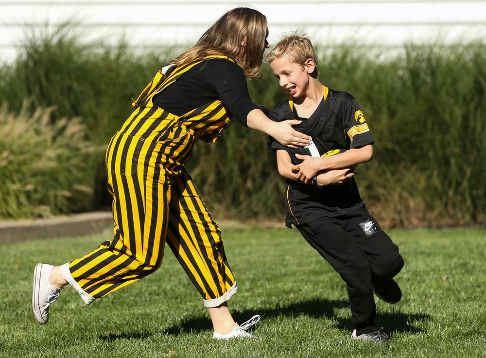 Young fans play a game of touch football before a game against Wisconsin on September 22, 2018.