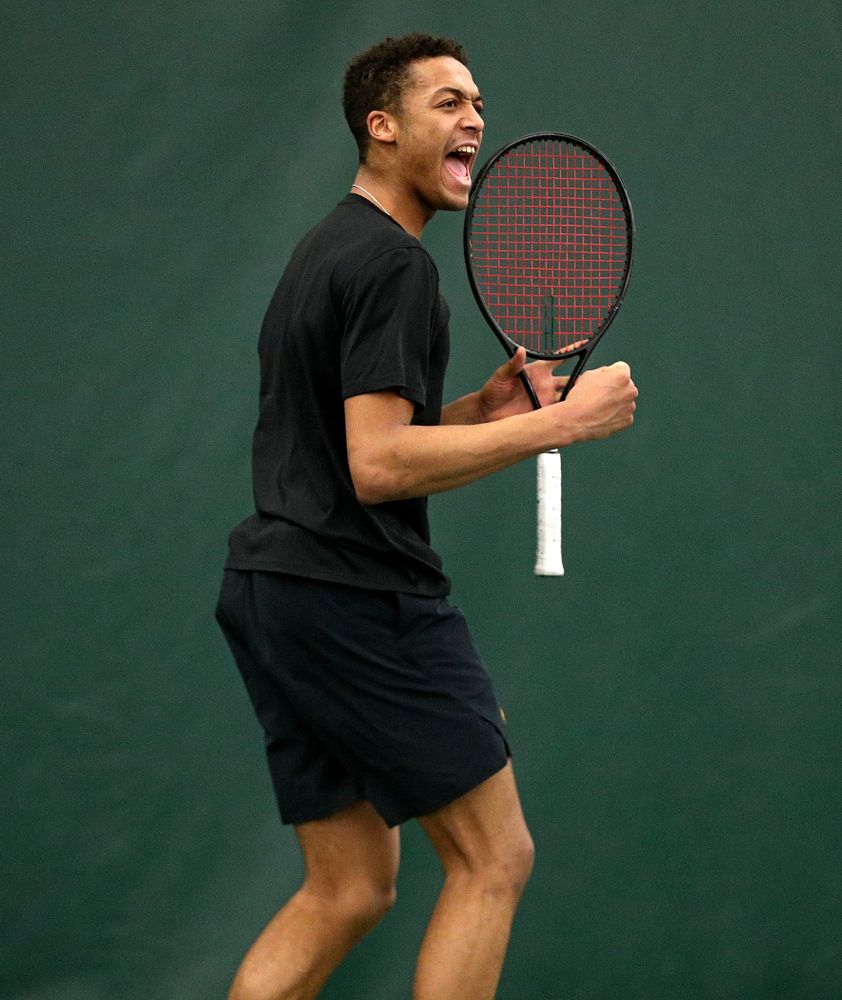 Iowa’s Oliver Okonkwo celebrates a point during his singles match at the Hawkeye Tennis and Recreation Complex in Iowa City on Friday, March 6, 2020. (Stephen Mally/hawkeyesports.com)