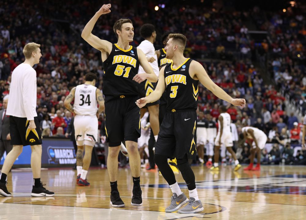 Iowa Hawkeyes guard Jordan Bohannon (3) and forward Nicholas Baer (51) against the Cincinnati Bearcats in the first round of the 2019 NCAA Men's Basketball Tournament Friday, March 22, 2019 at Nationwide Arena in Columbus, Ohio. (Brian Ray/hawkeyesports.com)