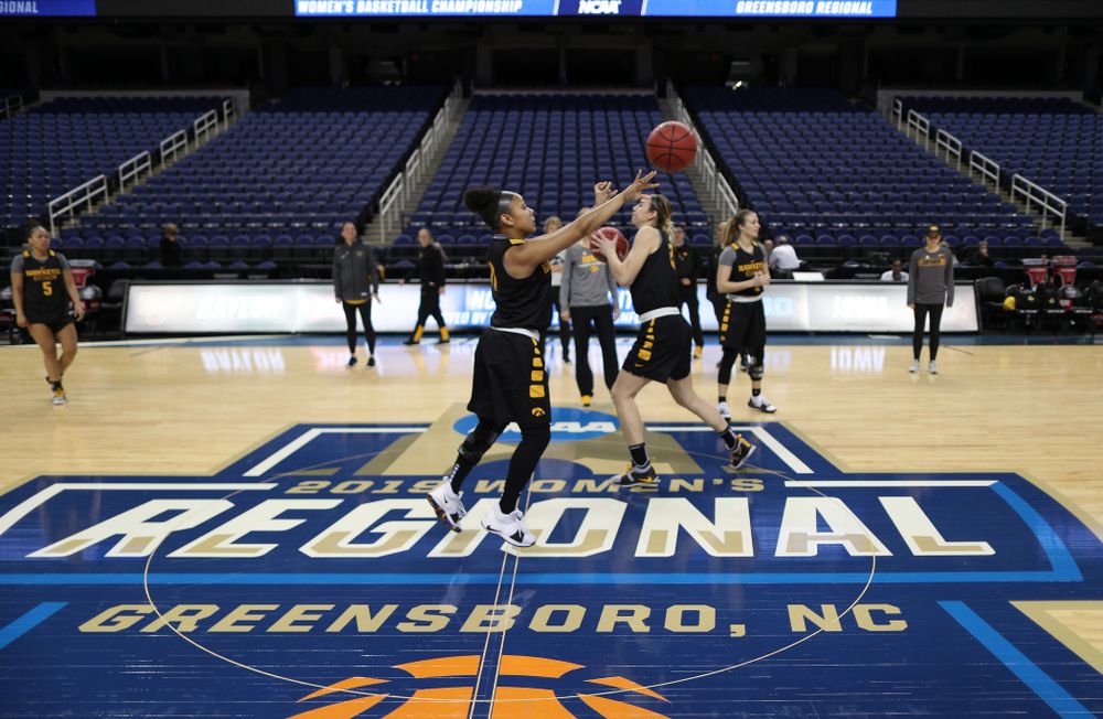 Iowa Hawkeyes guard Tania Davis (11) sinks a half court shot during shoot around before their regional final against the Baylor Lady Bears in the 2019 NCAA Women's College Basketball Tournament Monday, April 1, 2019 at Greensboro Coliseum in Greensboro, NC.(Brian Ray/hawkeyesports.com)