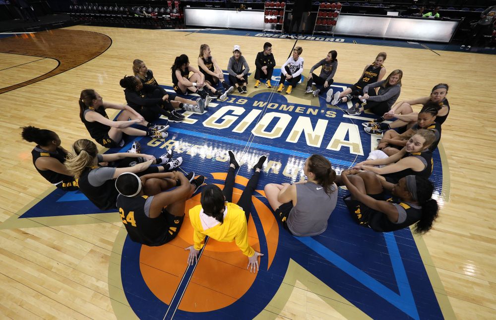 The Iowa Hawkeyes talk in their circle at the end of shoot around before their game against the NC State Wolfpack in the regional semi-final of the 2019 NCAA Women's College Basketball Tournament Saturday, March 30, 2019 at Greensboro Coliseum in Greensboro, NC.(Brian Ray/hawkeyesports.com)