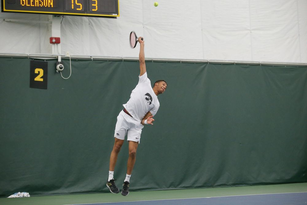 Iowa’s Oliver Okonkwo serves the ball during the Iowa men’s tennis meet vs Nebraska on Sunday, March 1, 2020 at the Hawkeye Tennis and Recreation Complex. (Lily Smith/hawkeyesports.com)