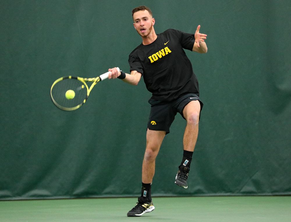 Iowa’s Kareem Allaf returns a shot during his singles match at the Hawkeye Tennis and Recreation Complex in Iowa City on Friday, February 14, 2020. (Stephen Mally/hawkeyesports.com)