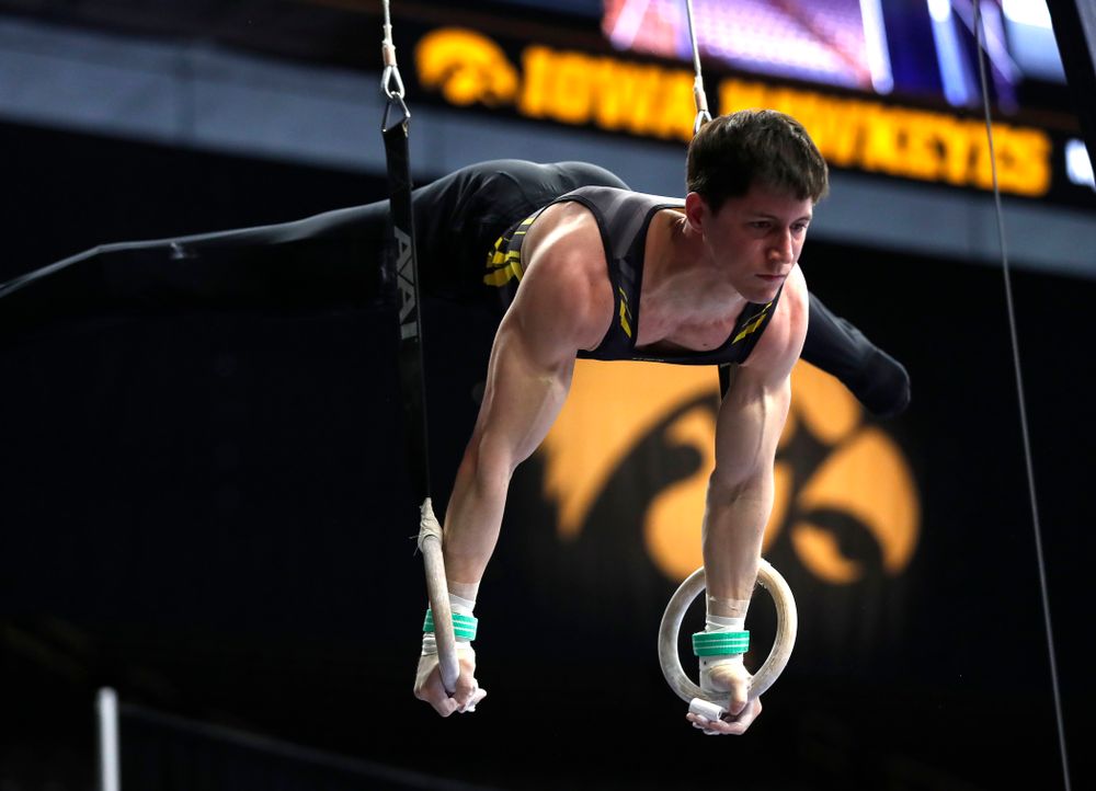 Mark Springette competes on the rings against Minnesota and Air Force 