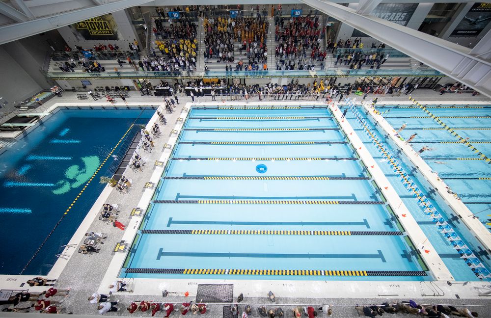People stand for the National Anthem during the 2020 Women’s Big Ten Swimming and Diving Championships at the Campus Recreation and Wellness Center in Iowa City on Thursday, February 20, 2020. (Stephen Mally/hawkeyesports.com)