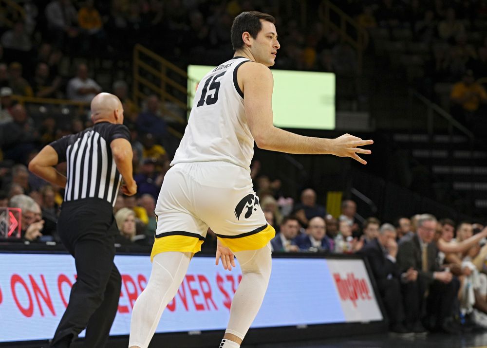 Iowa Hawkeyes forward Ryan Kriener (15) holds up three fingers after making a 3-pointer during the first half of their their game at Carver-Hawkeye Arena in Iowa City on Sunday, December 29, 2019. (Stephen Mally/hawkeyesports.com)