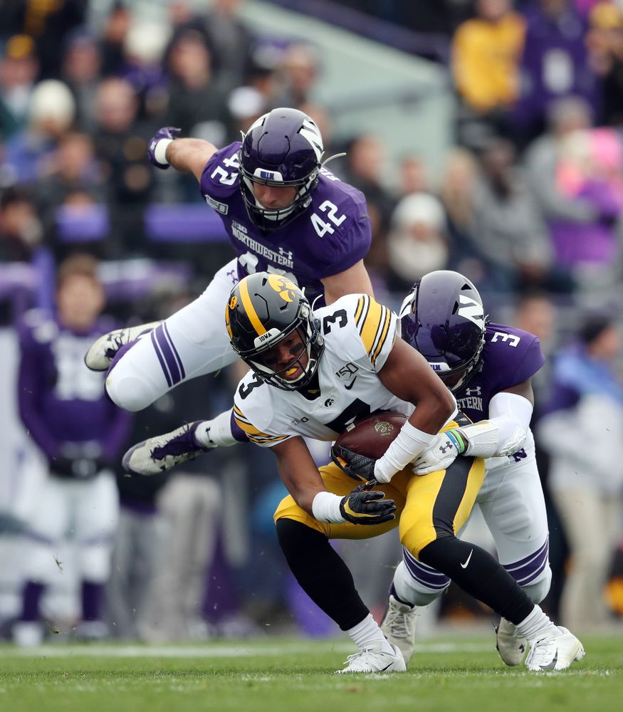 Iowa Hawkeyes wide receiver Tyrone Tracy Jr. (3) spins out of a tackle on his way to a touchdown against the Northwestern Wildcats Saturday, October 26, 2019 at Ryan Field in Evanston, Ill. (Brian Ray/hawkeyesports.com)