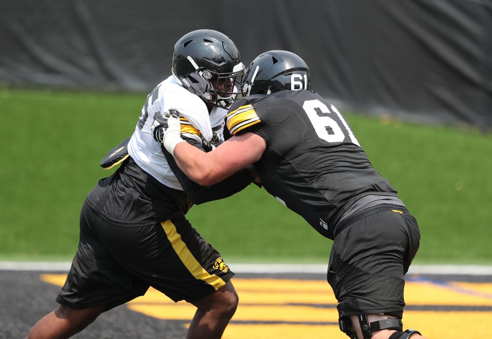 Iowa Hawkeyes defensive lineman Cedrick Lattimore (95) against offensive lineman Cole Banwart (61) during the third practice of fall camp Sunday, August 5, 2018 at the Kenyon Football Practice Facility. (Brian Ray/hawkeyesports.com)