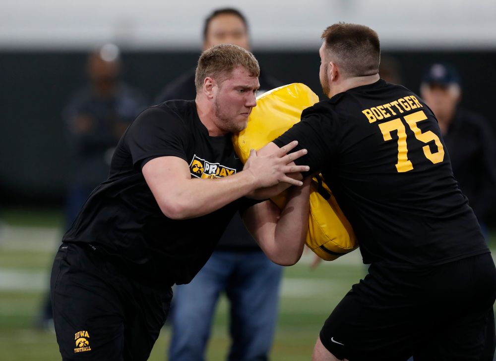Iowa Hawkeyes offensive lineman Boone Myers (52) and offensive lineman Ike Boettger (75) during the team's annual pro day Monday, March 26, 2018 at the Hansen Football Performance Center. (Brian Ray/hawkeyesports.com)
