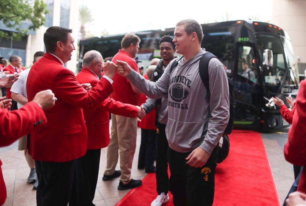 Iowa Hawkeyes quarterback Nate Stanley (4) shakes hands with the ÒRed CoatsÓ after arriving in San Diego, CA Saturday, December 21, 2019 for the Holiday Bowl. (Brian Ray/hawkeyesports.com)
