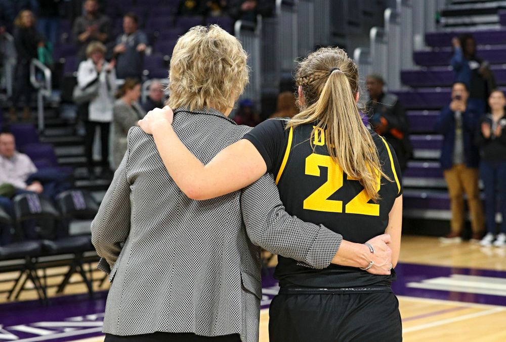 Iowa Hawkeyes head coach Lisa Bluder and guard Kathleen Doyle (22) share a laugh as they walk off the court after winning their game at Welsh-Ryan Arena in Evanston, Ill. on Sunday, January 5, 2020. (Stephen Mally/hawkeyesports.com)