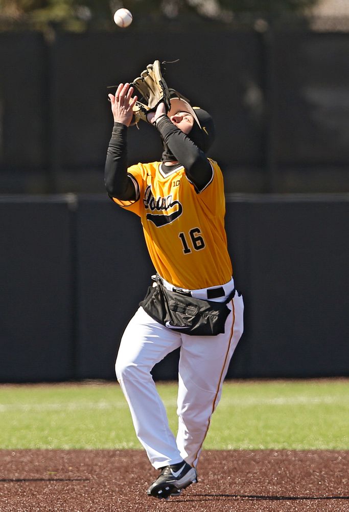 Iowa Hawkeyes shortstop Tanner Wetrich (16) fields a pop up for an out during the sixth inning against Illinois at Duane Banks Field in Iowa City on Sunday, Mar. 31, 2019. (Stephen Mally/hawkeyesports.com)