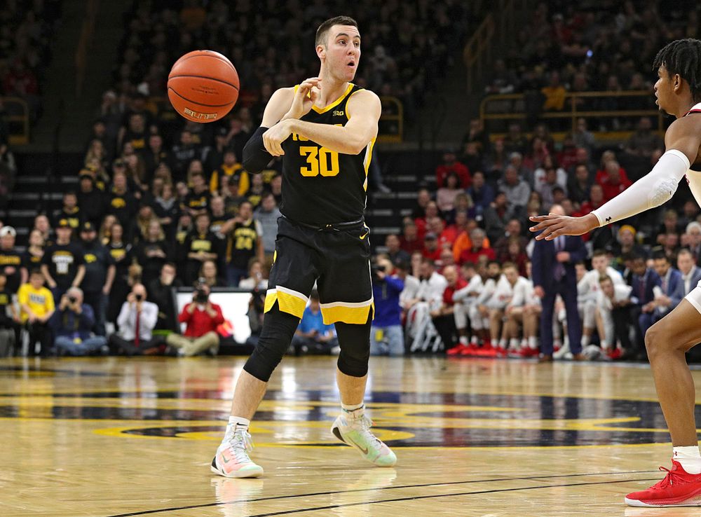 Iowa Hawkeyes guard Connor McCaffery (30) passes the ball during the second half of their game at Carver-Hawkeye Arena in Iowa City on Monday, January 27, 2020. (Stephen Mally/hawkeyesports.com)