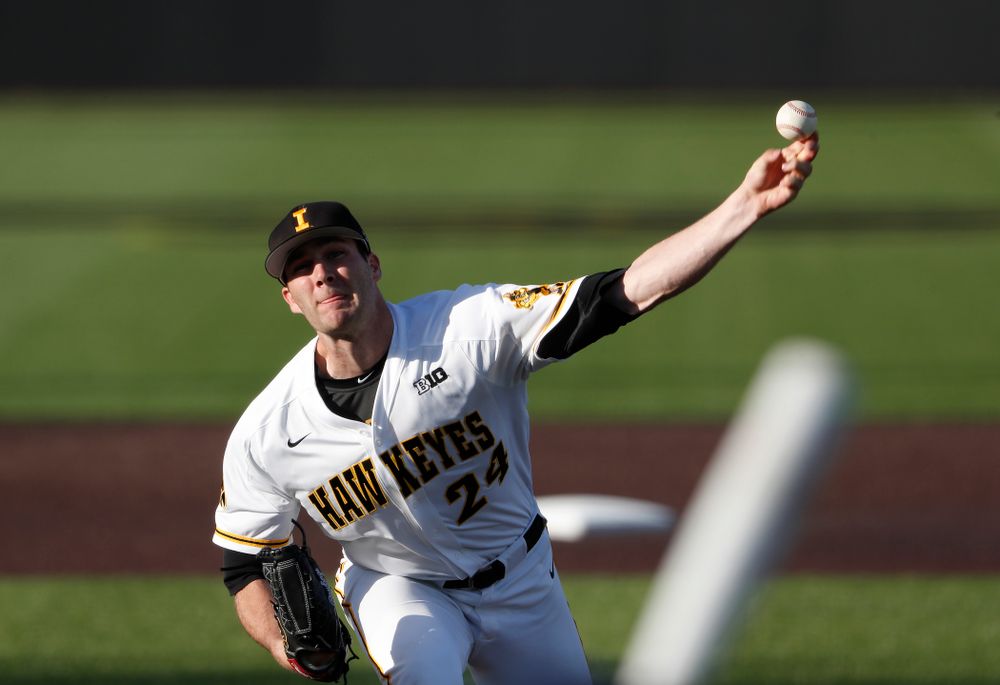 Iowa Hawkeyes pitcher Nick Allgeyer (24) delivers the ball to the plate against the Michigan Wolverines Friday, April 27, 2018 at Duane Banks Field in Iowa City. (Brian Ray/hawkeyesports.com)