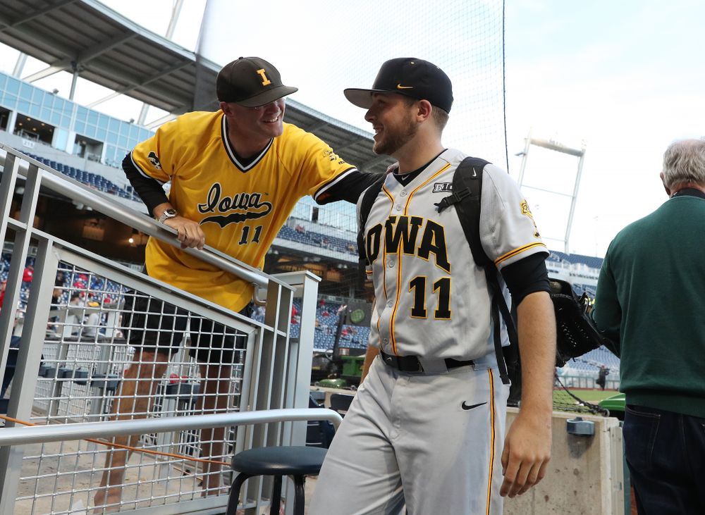 Iowa Hawkeyes Cole McDonald (11) hugs his father after getting the win against the Indiana Hoosiers in the first round of the Big Ten Baseball Tournament Wednesday, May 22, 2019 at TD Ameritrade Park in Omaha, Neb. (Brian Ray/hawkeyesports.com)