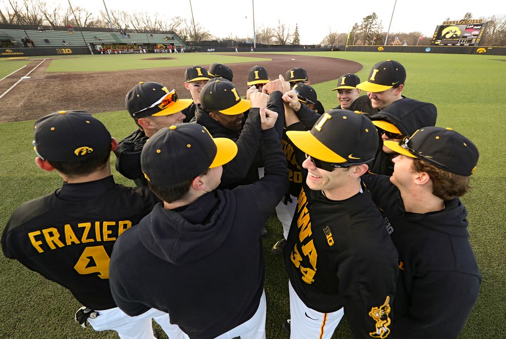 The Hawkeyes huddle before their game at Duane Banks Field in Iowa City on Tuesday, March 3, 2020. (Stephen Mally/hawkeyesports.com)