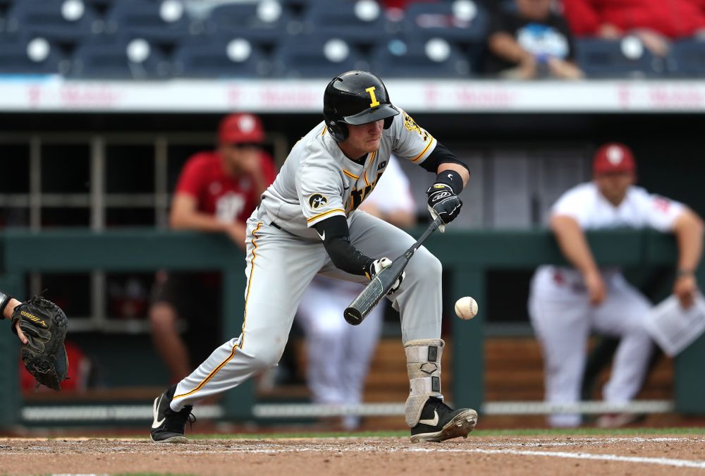 Iowa Hawkeyes infielder Brendan Sher (2) puts down a sacrifice bunt against the Indiana Hoosiers in the first round of the Big Ten Baseball Tournament Wednesday, May 22, 2019 at TD Ameritrade Park in Omaha, Neb. (Brian Ray/hawkeyesports.com)