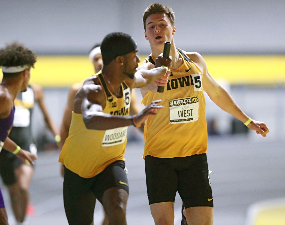 Iowa’s Austin West (right) hands off the baton to Antonio Woodard as they run the men’s 1600 meter relay event during the Hawkeye Invitational at the Recreation Building in Iowa City on Saturday, January 11, 2020. (Stephen Mally/hawkeyesports.com)