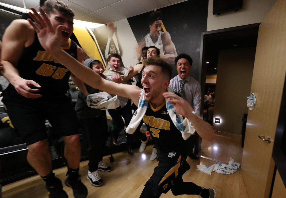 Iowa Hawkeyes guard Jordan Bohannon (3) celebrates with his teammates after defeating the Indiana Hoosiers in overtime Friday, February 22, 2019 at Carver-Hawkeye Arena. (Brian Ray/hawkeyesports.com)
