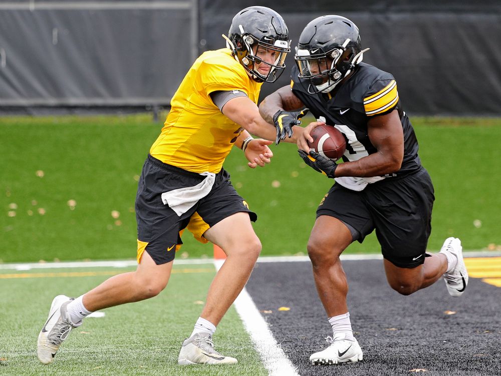 Iowa Hawkeyes quarterback Nate Stanley (4) hands the ball off to running back Mekhi Sargent (10) during Fall Camp Practice No. 15 at the Hansen Football Performance Center in Iowa City on Monday, Aug 19, 2019. (Stephen Mally/hawkeyesports.com)