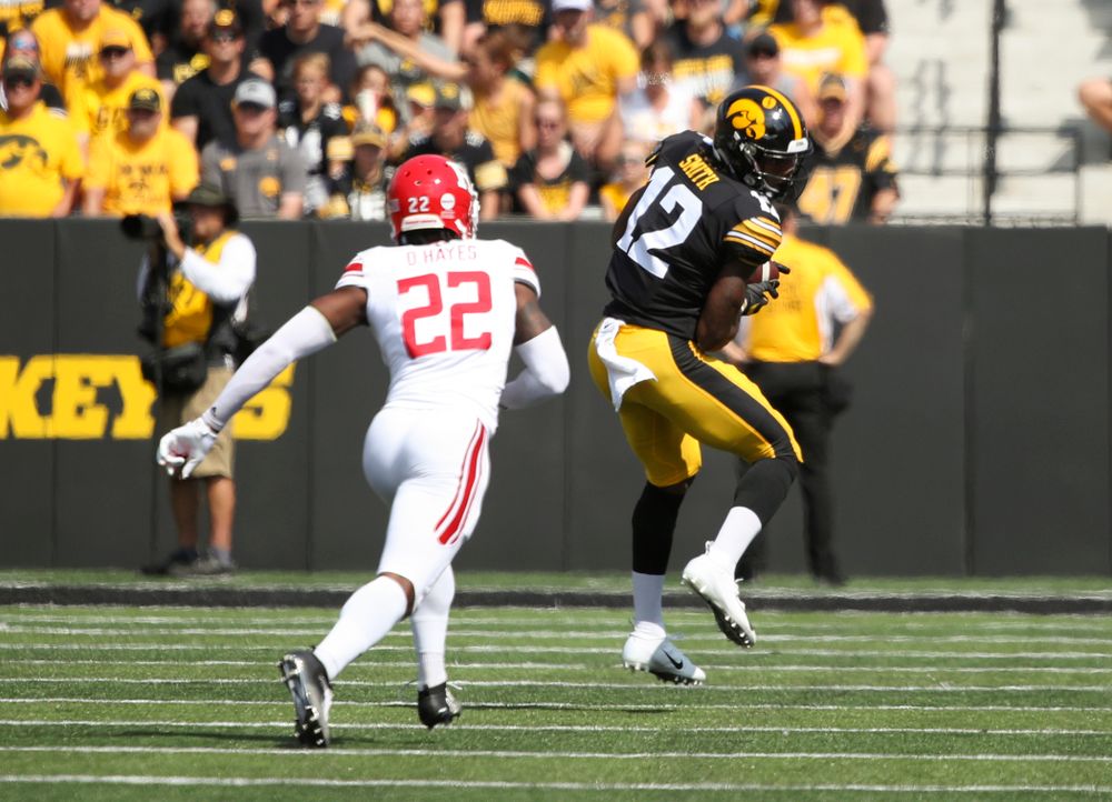 Iowa Hawkeyes wide receiver Brandon Smith (12) pulls in a pass during the first quarter of their Big Ten Conference football game at Kinnick Stadium in Iowa City on Saturday, Sep 7, 2019. (Stephen Mally/hawkeyesports.com)