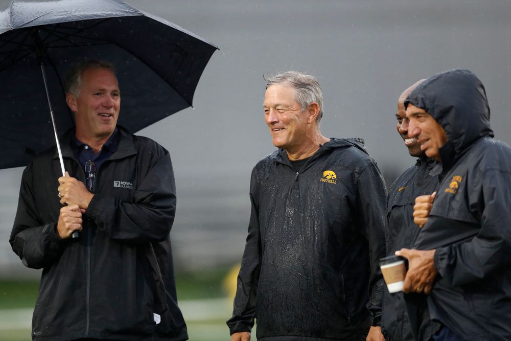 Iowa Hawkeyes head coach Kirk Ferentz  talks with BTN's Gerry DiNardo, Howard Griffith, and Chuck Long during camp practice No. 15  Monday, August 20, 2018 at the Hansen Football Performance Center. (Brian Ray/hawkeyesports.com)