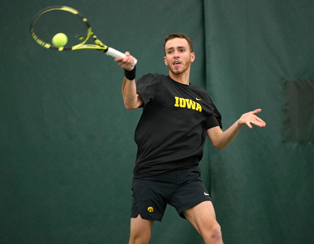 Iowa’s Kareem Allaf hits a shot during his match against Marquette at the Hawkeye Tennis and Recreation Complex in Iowa City on Saturday, January 25, 2020. (Stephen Mally/hawkeyesports.com)