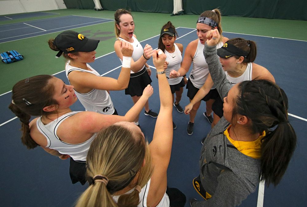 The Hawkeyes huddle before their match at the Hawkeye Tennis and Recreation Complex in Iowa City on Sunday, February 16, 2020. (Stephen Mally/hawkeyesports.com)