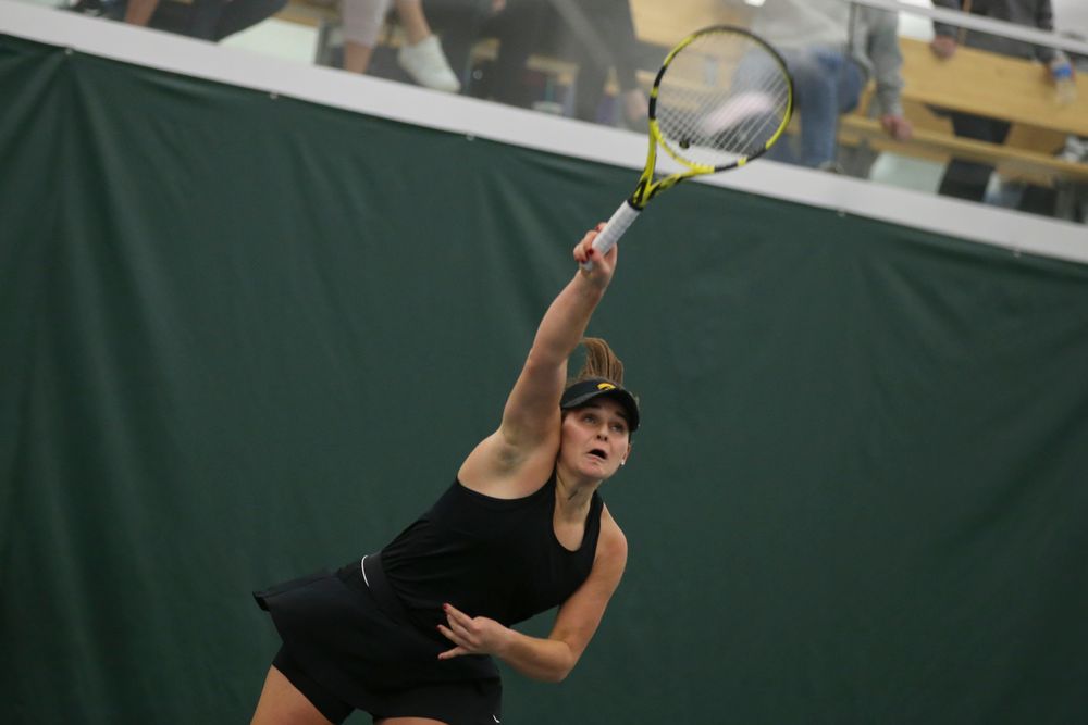 Iowa’s Danielle Bauers serves a ball during the Iowa women’s tennis meet vs UNI  on Saturday, February 29, 2020 at the Hawkeye Tennis and Recreation Complex. (Lily Smith/hawkeyesports.com)