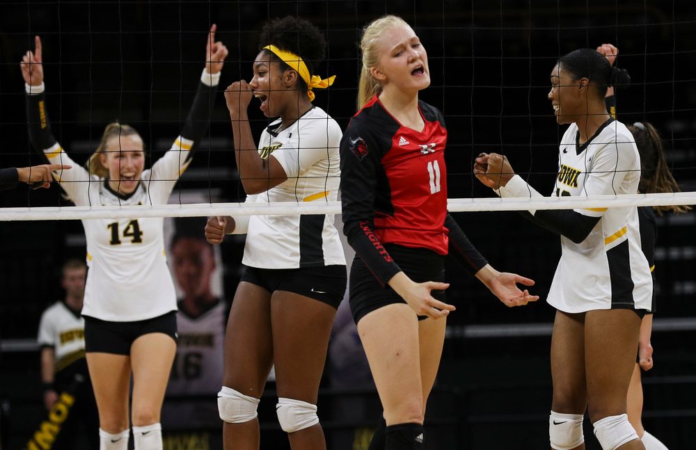 Iowa Hawkeyes middle blocker Amiya Jones (9) and Iowa Hawkeyes outside hitter Taylor Louis (16) celebrate after winning a point during a match against Rutgers at Carver-Hawkeye Arena on November 2, 2018. (Tork Mason/hawkeyesports.com)