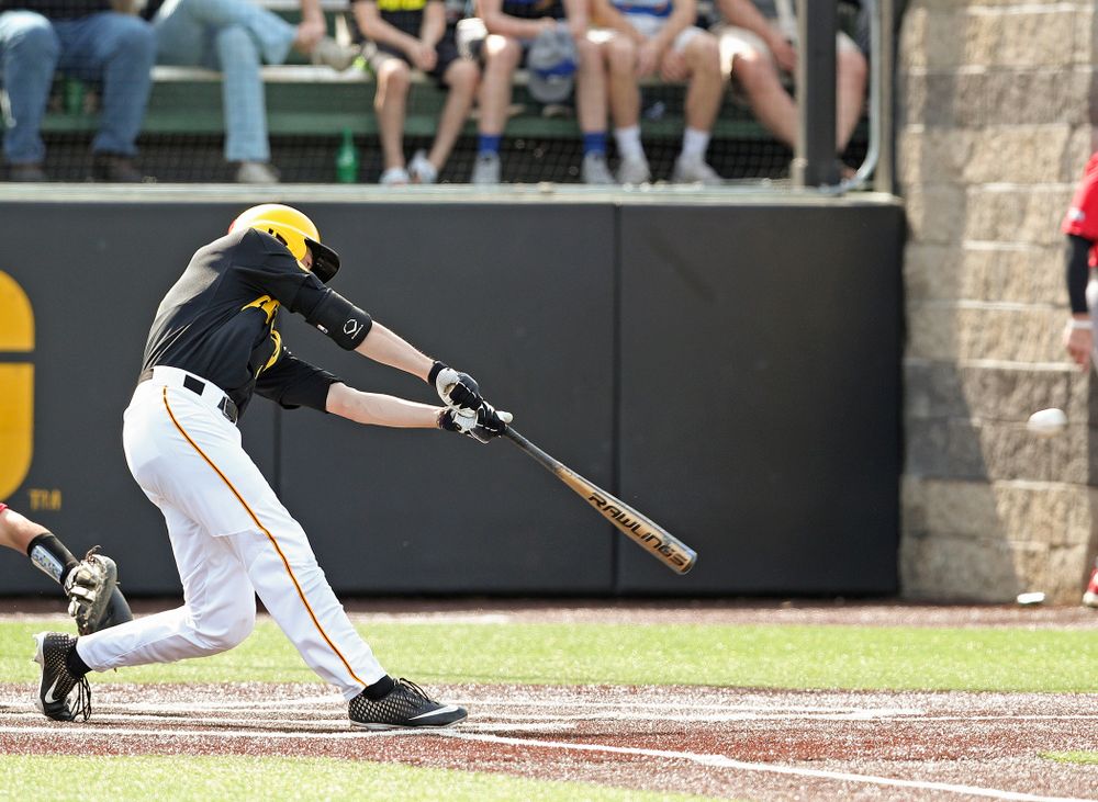 Iowa Hawkeyes center fielder Ben Norman (9) hits an RBI double during the sixth inning of their game against Rutgers at Duane Banks Field in Iowa City on Saturday, Apr. 6, 2019. (Stephen Mally/hawkeyesports.com)