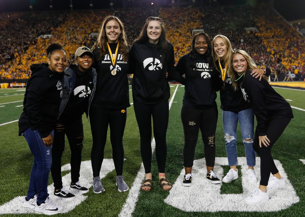 Members of the Iowa women's basketball team are recognized by the Presidential Committee on Athletics at halftime during a game against Wisconsin on September 22, 2018. (Tork Mason/hawkeyesports.com)