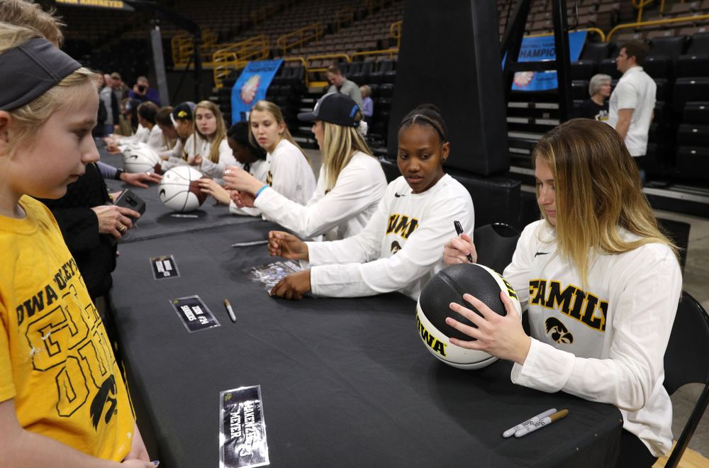 Iowa Hawkeyes guard Makenzie Meyer (3) signs autographs during a celebration of their Big Ten Women's Basketball Tournament championship Monday, March 18, 2019 at Carver-Hawkeye Arena. (Brian Ray/hawkeyesports.com)