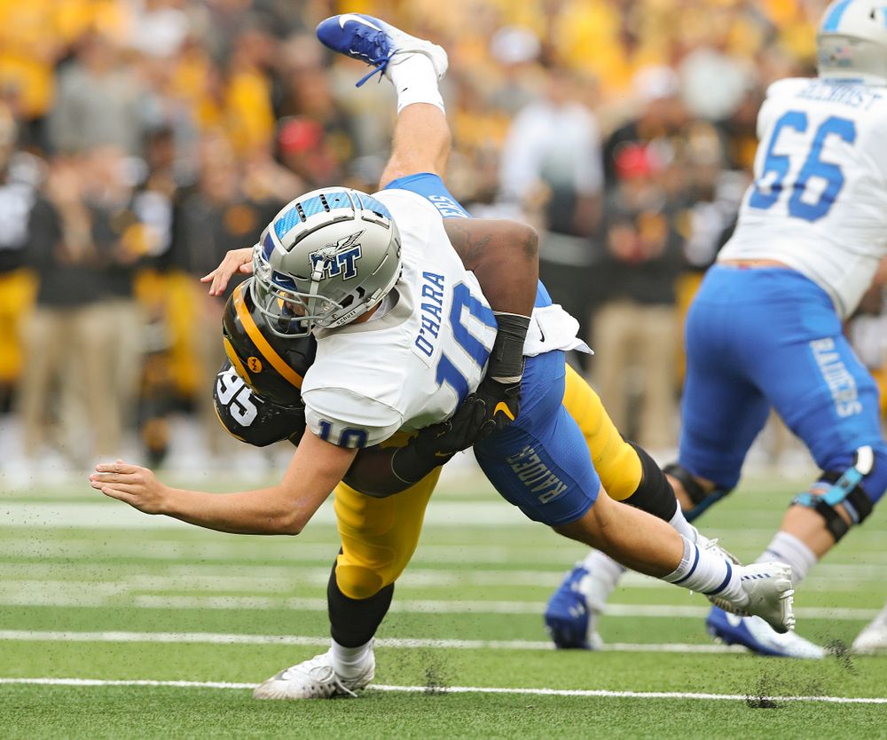 Iowa Hawkeyes defensive lineman Cedrick Lattimore (95) brings down Middle Tennessee State quarterback Asher O’Hara (10) during the first quarter of their game at Kinnick Stadium in Iowa City on Saturday, Sep 28, 2019. (Stephen Mally/hawkeyesports.com)