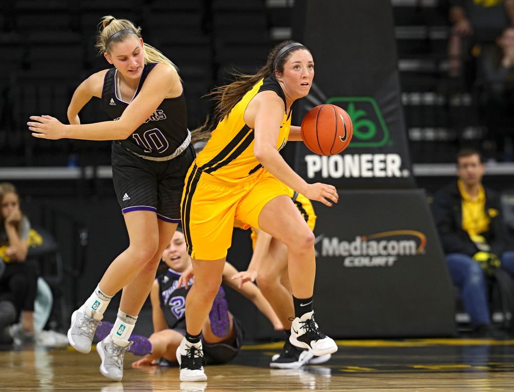 Iowa guard/forward McKenna Warnock (14) brings the ball down court during the second quarter of their game against Winona State at Carver-Hawkeye Arena in Iowa City on Sunday, Nov 3, 2019. (Stephen Mally/hawkeyesports.com)